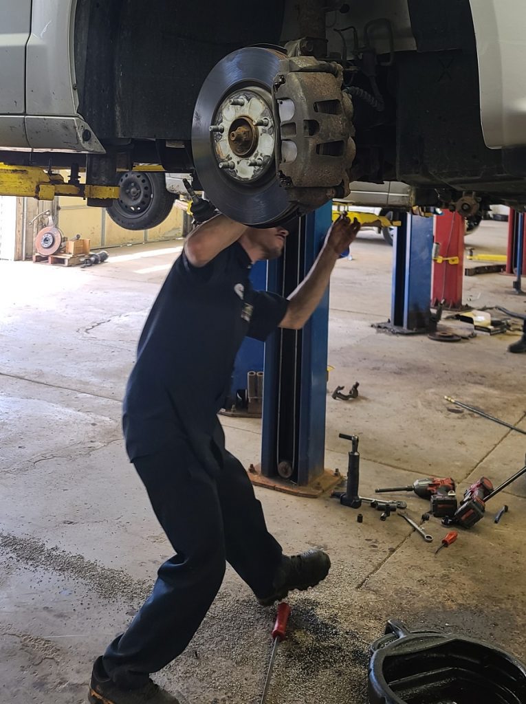 worker working under vehicle