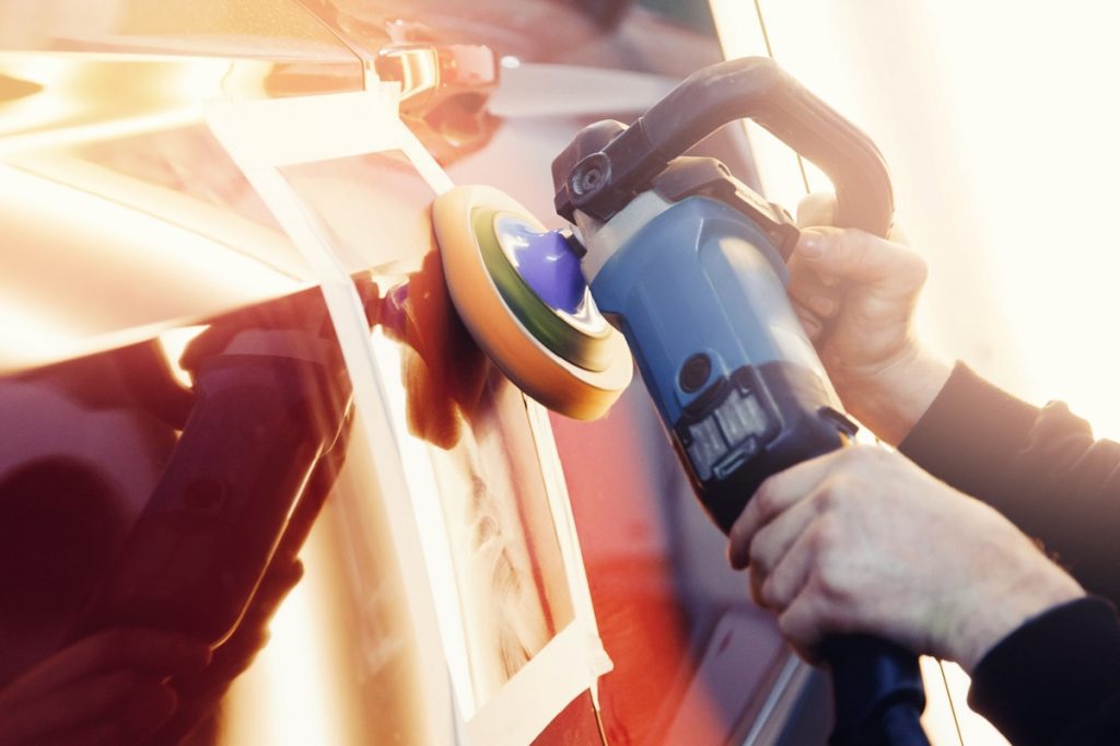 close up of someone buffing a car